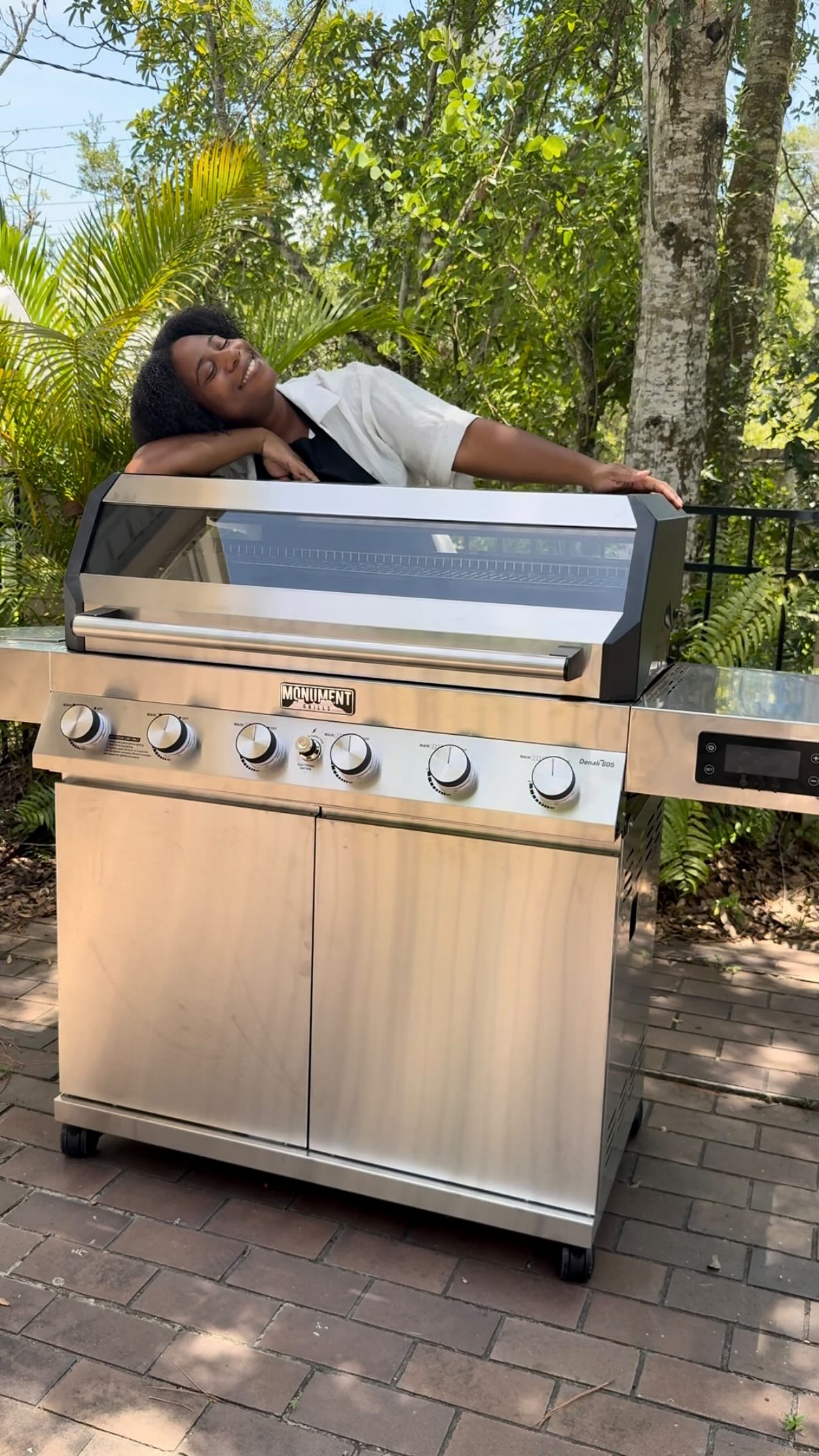 Instagram post by @typhaniecooks for Monument Grills. Caption reads: [...] be grilling all year round with....