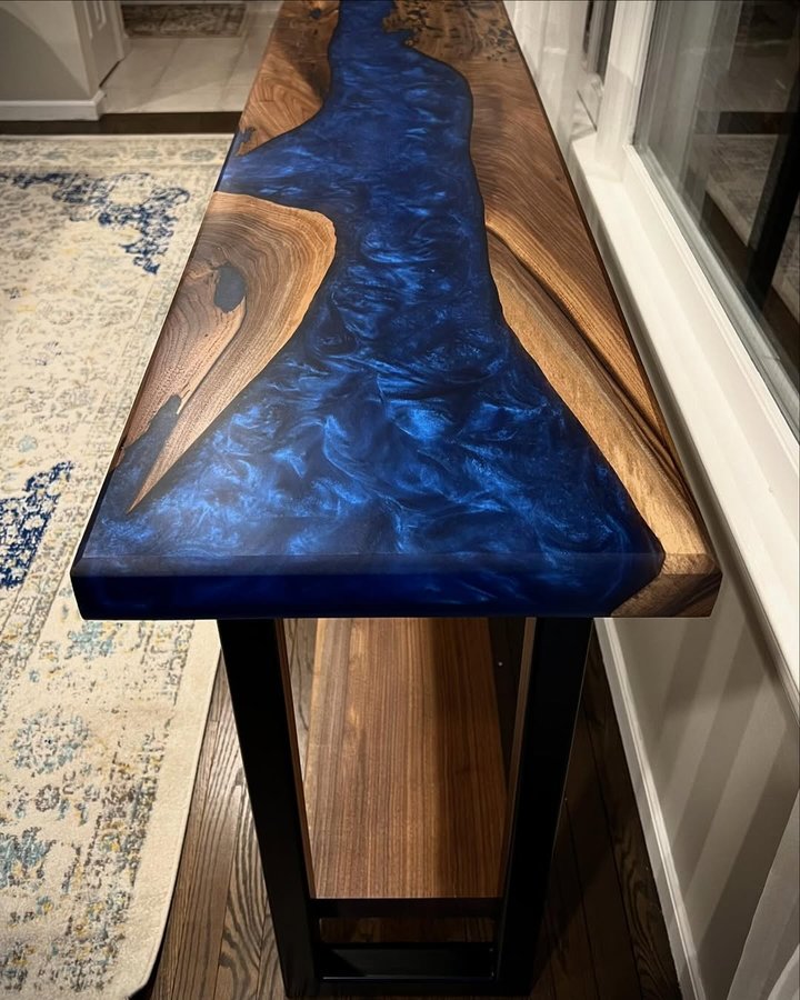 Instagram post by @cfwoodworksllc for Eye Candy Pigments. Caption reads: [...] table. Made with @superclearepoxy....