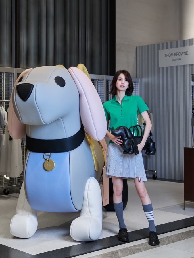 Instagram post by @sato_harumi__official for Thom Browne. Caption reads: ThomBrowne🐶🕺 大阪の阪急うめだ本店1Fにて行われている [...].