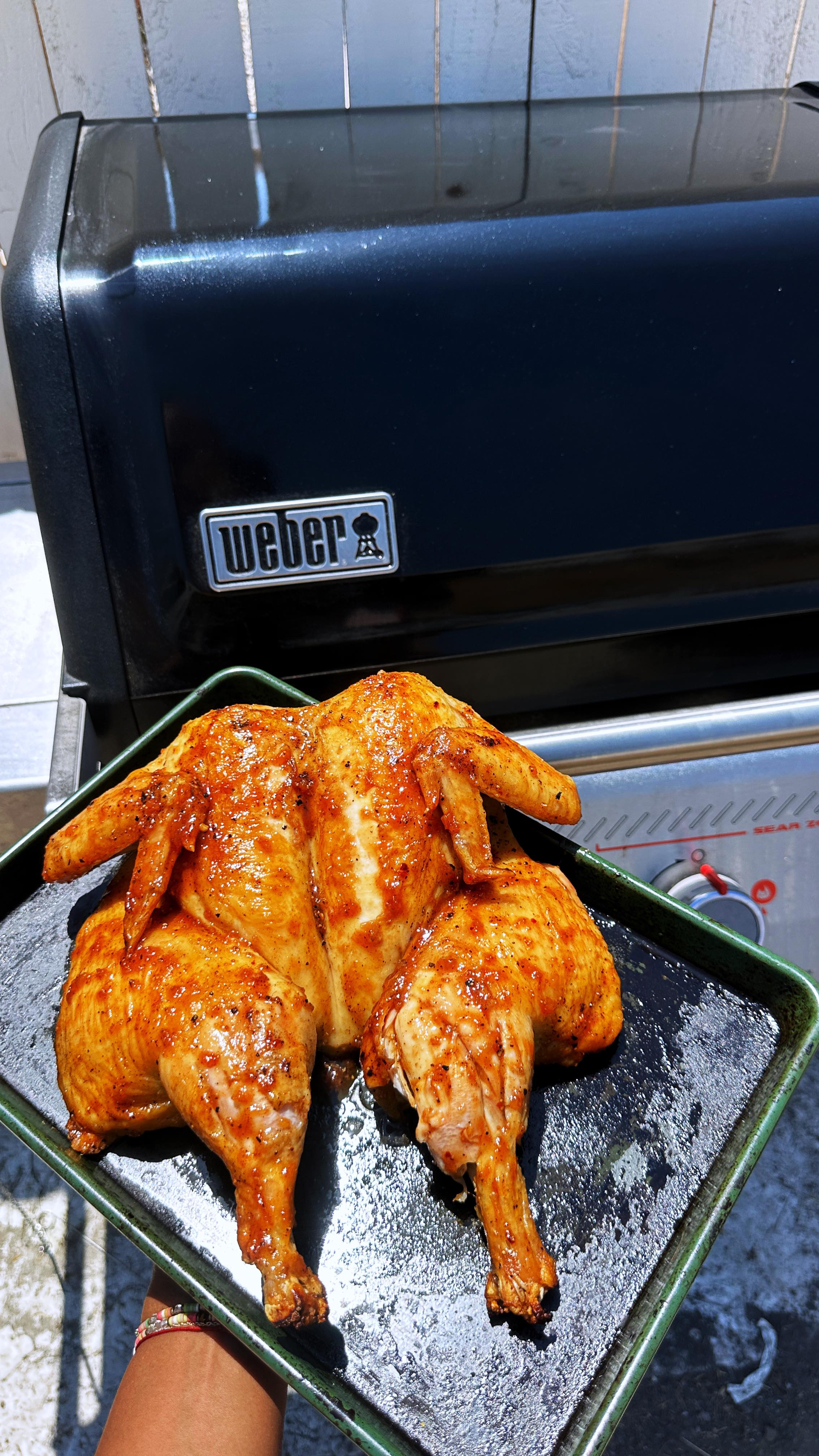 Instagram post by @justaddhotsauce for Weber Grills. Caption reads: [...] easiest spatchcock chicken recipe!....