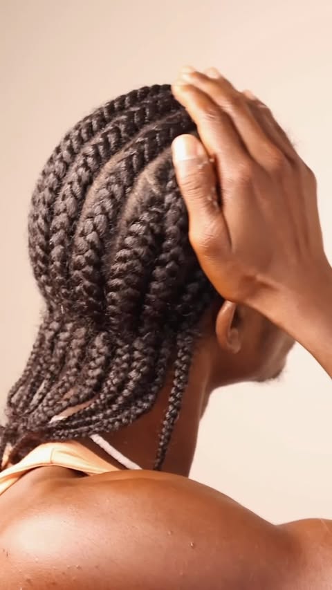 Instagram post by @ahmed_reynolds_ for Camille Rose. Caption reads: Kriss-Kross Braids with @camillerosenaturals....