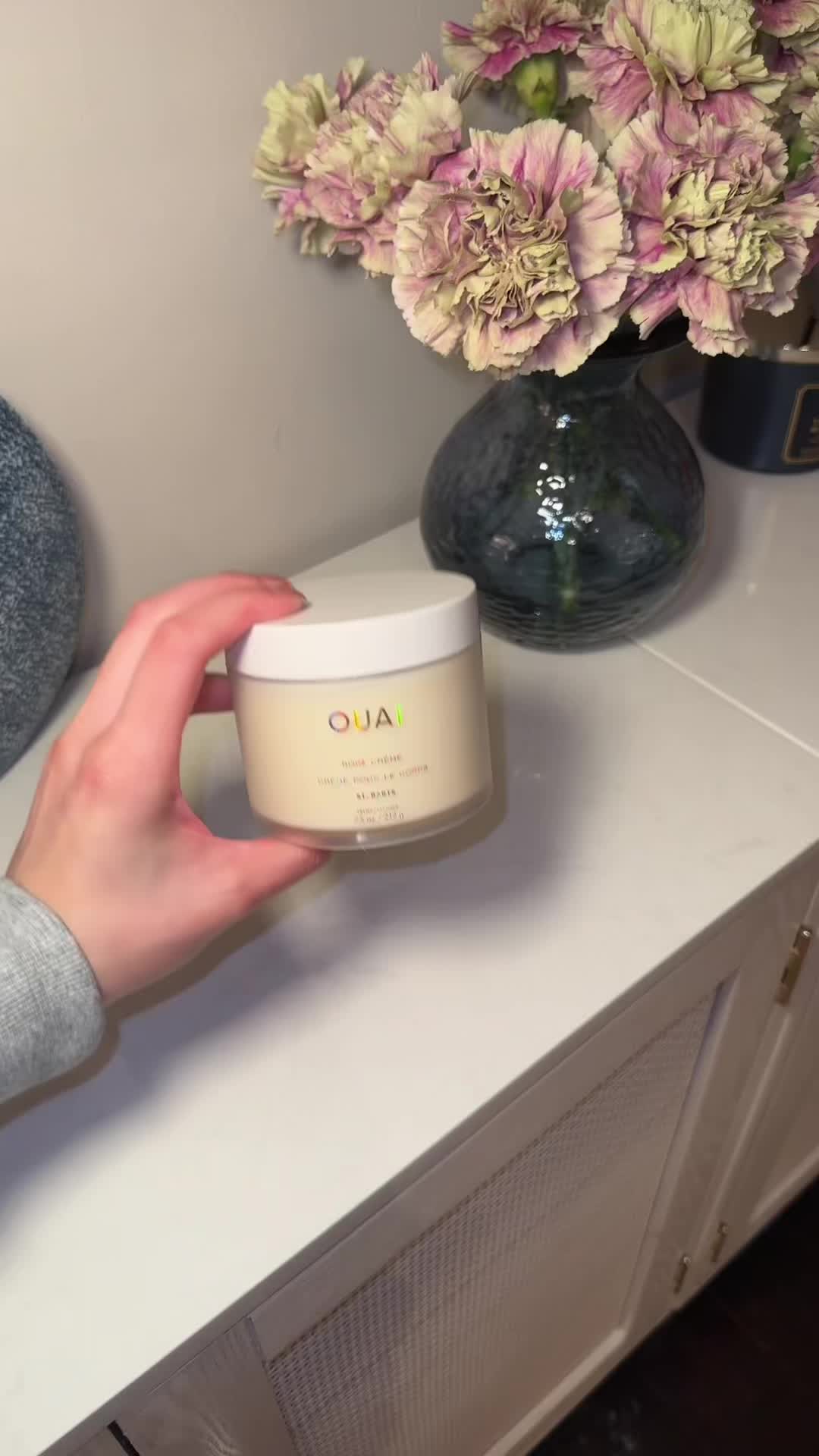 TikTok post by @psychictexas for OUAI. Caption reads: Absolutely obsessed with the ouais body cream....