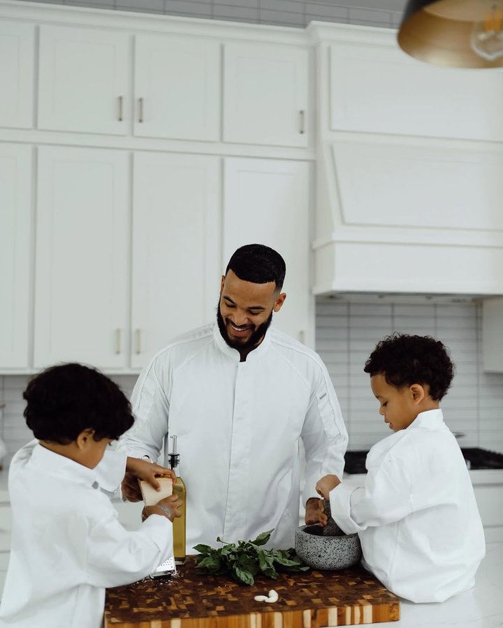 Instagram post by @desmondscott for Fidelity Investments. Caption reads: Time in the kitchen with my boys often makes me....