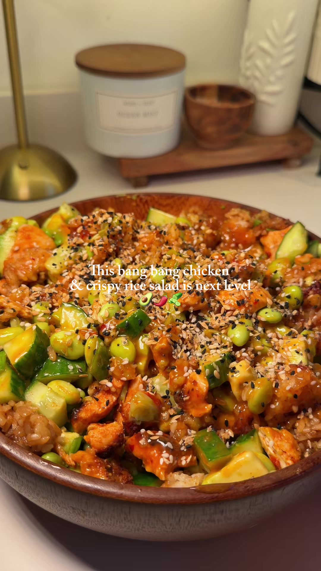 TikTok post by @recipes.with.ren for Cornish Sea Salt. Caption reads: CRISPY RICE BANG BANG CHICKEN SALAD 🌶️🥑✨ If....