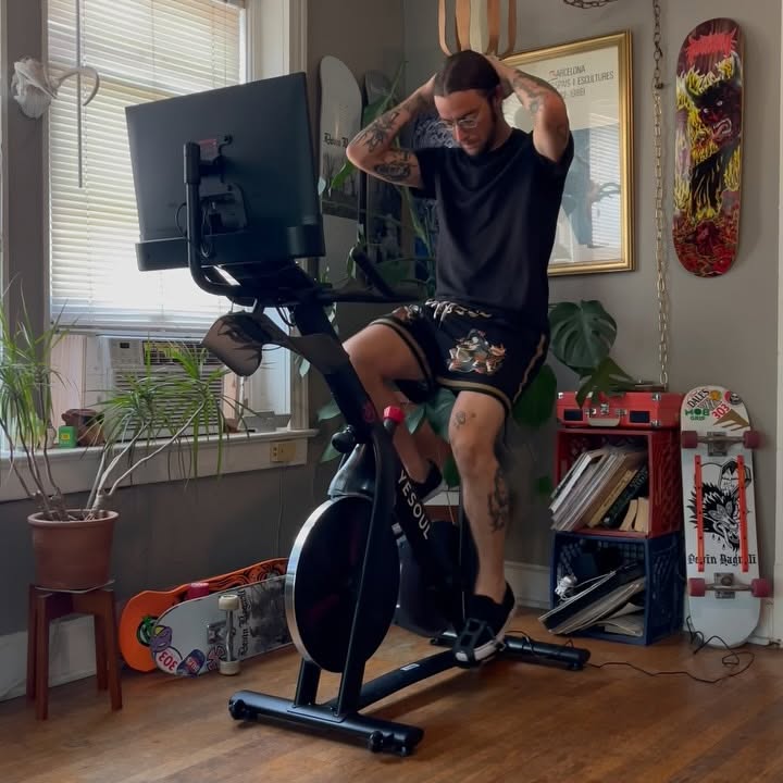 Instagram post by @devinbagnoli for YESOUL FITNESS. Caption reads: Stoked to add the Yesoul G1M plus indoor bicycle....
