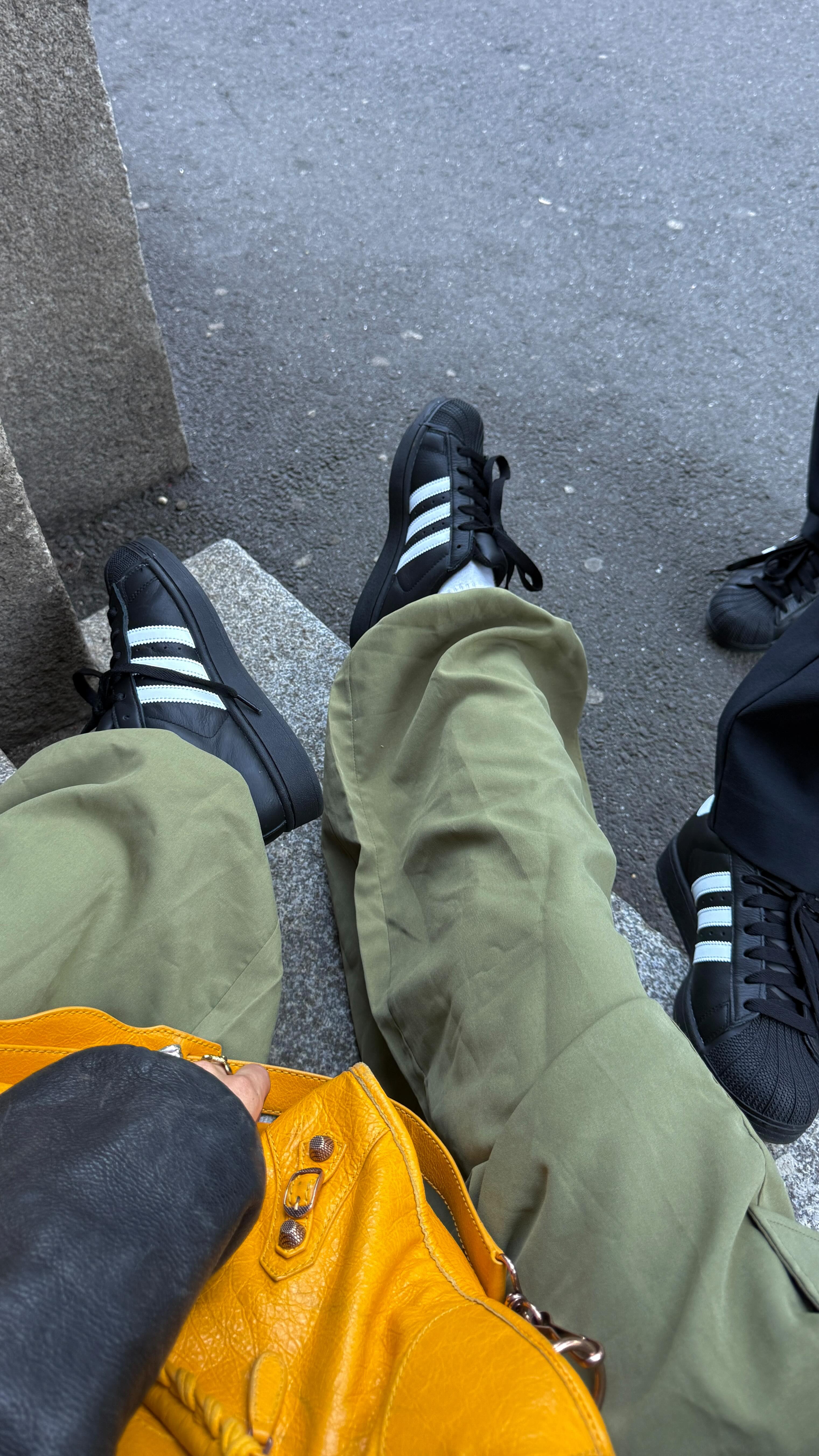 Instagram post by an influencer for adidas Germany. Caption reads: anzeige | all black outfits are cool w/ the....