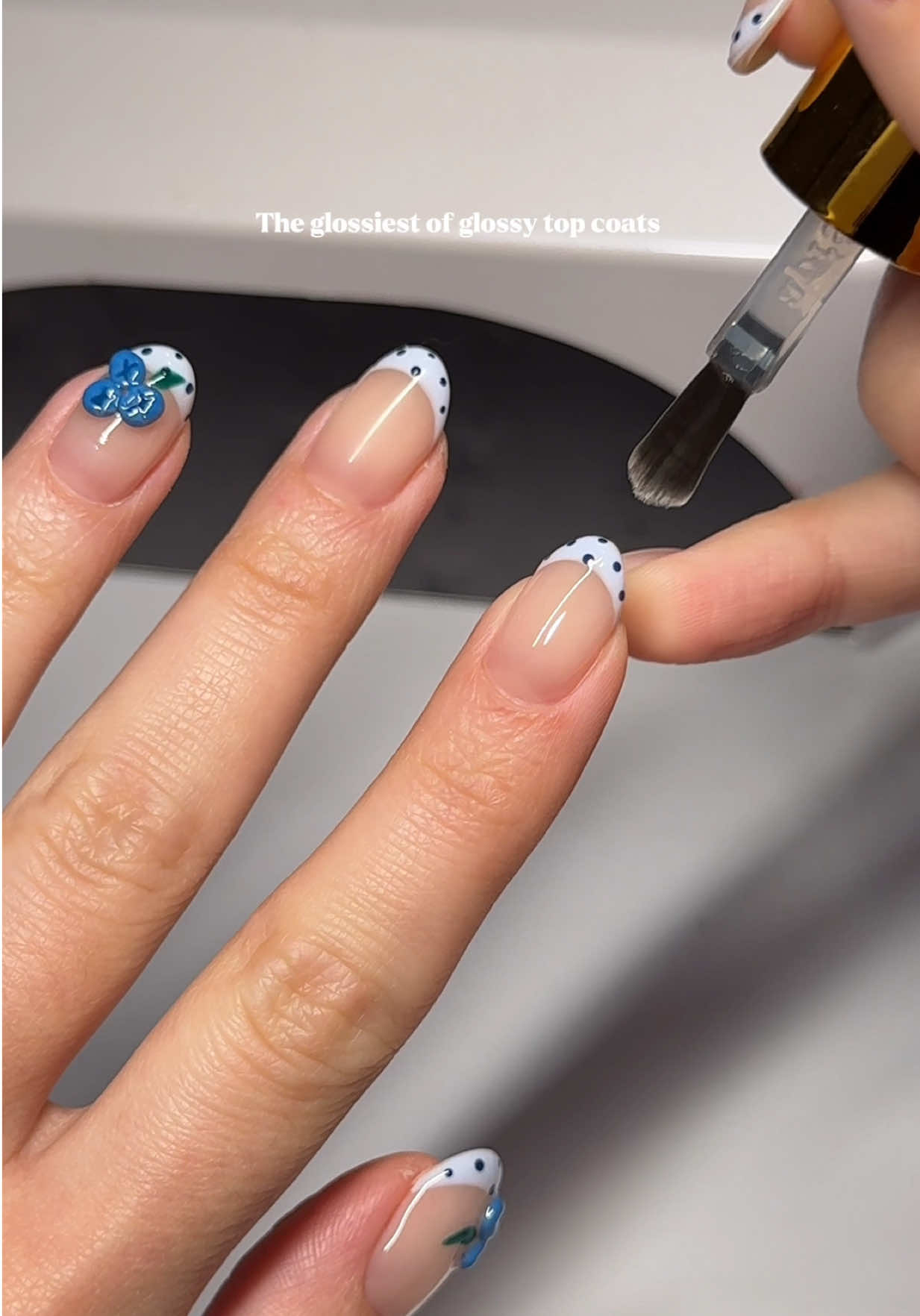 TikTok post by @annabuscarino for Après Nail. Caption reads: Like GLASS 🪞✨ #apresgelx #nonwipetopcoat....