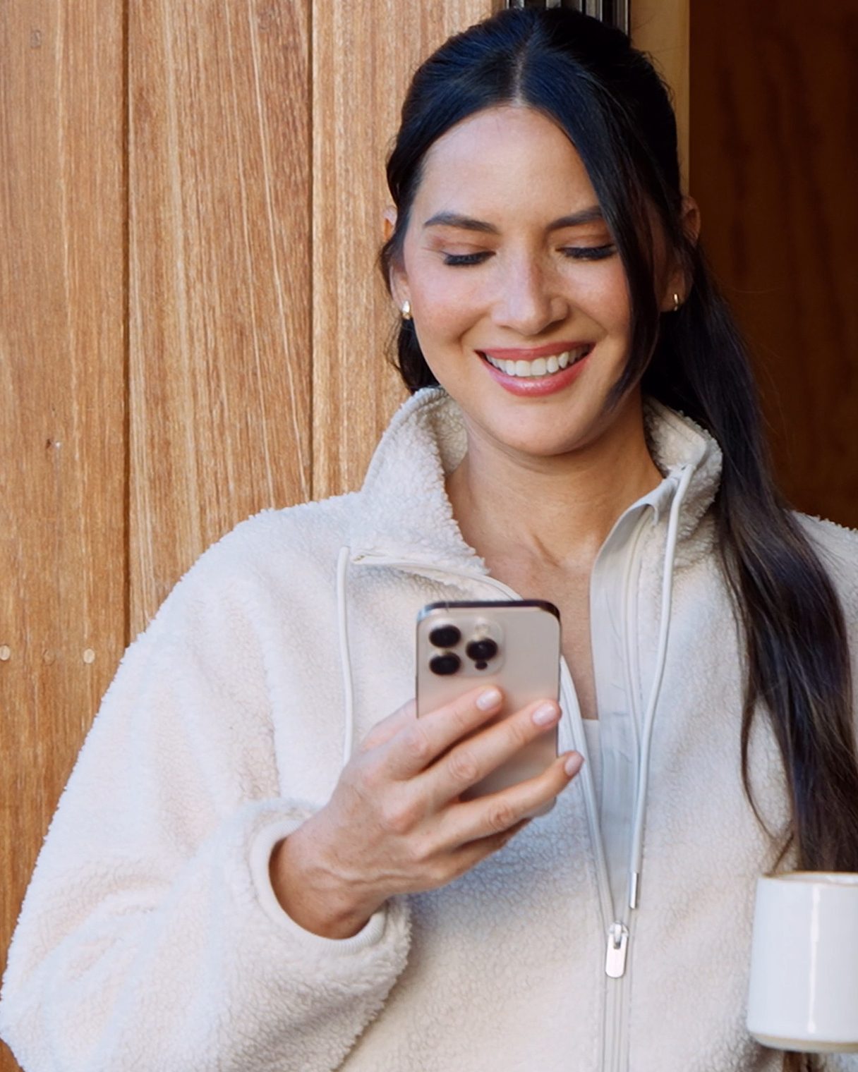 Instagram post by @oliviamunn for Athleta. Caption reads: Celebrate the wins. Every 👏 single 👏 one 👏.