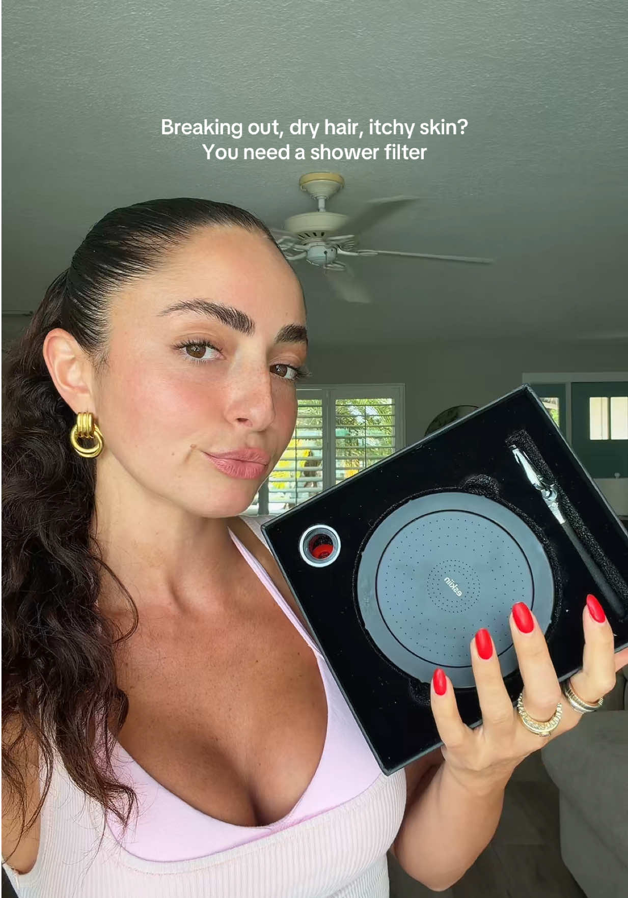 TikTok post by @sabinagilman1998 for Eskiin. Caption reads: [...] my hair was getting a shower filter !....