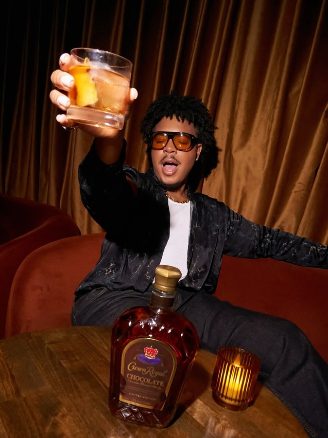 Instagram post by @scotlouie for Crown Royal. Caption reads: #ad kicking off the launch of @crownroyal....