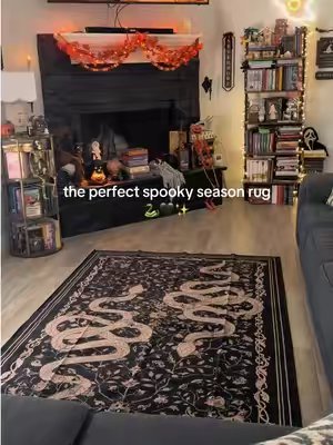 TikTok post by @the.cozyy.girl for Lahome. Caption reads: Loovveee this rug from @lahome 🖤🐍✨ #spookyseason....