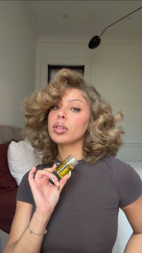 Instagram post by @goldynaps for OLAPLEX. Caption reads: Keep your hair shining all winter long with....