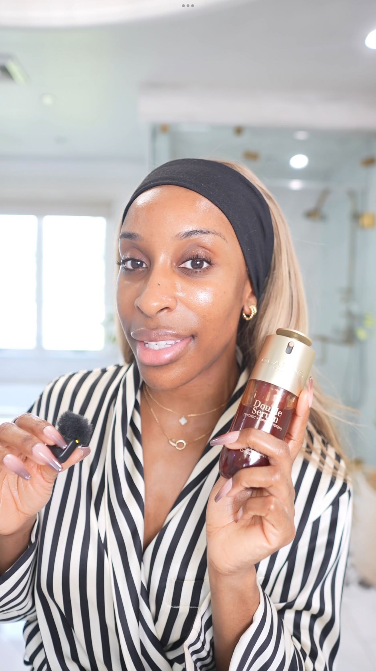 Instagram post by @jackieaina for CLARINS USA. Caption reads: This is your sign to upgrade your skincare game....