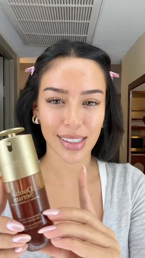 Instagram post by @ashlyncastro for Clarins. Caption reads: Radiance in a bottle ✨ @clarinsusa #clarinspartner.