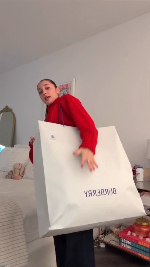 Instagram post by @haileysani for Burberry. Caption reads: @burberry night out 🎁 #grwm.