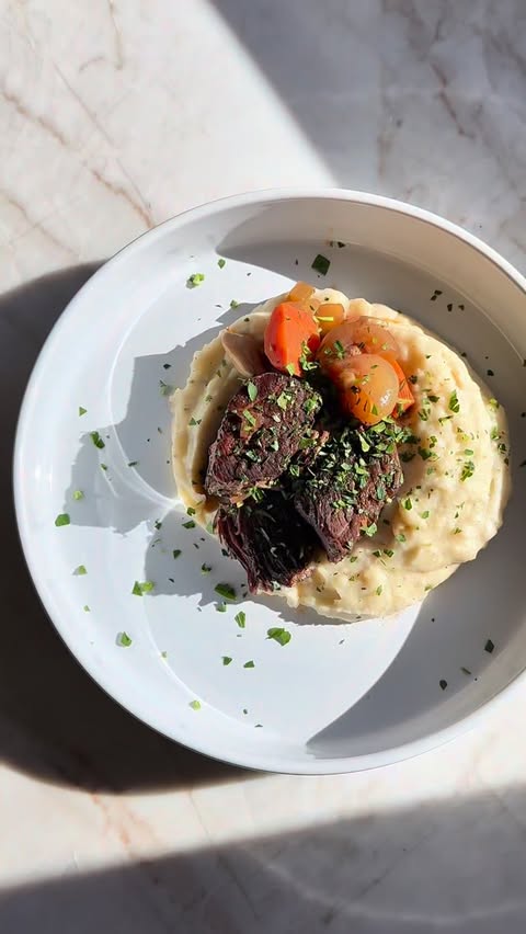 Instagram post by @injoskitchen for Shipt. Caption reads: [...] cozy red wine–braised short ribs on @shipt....