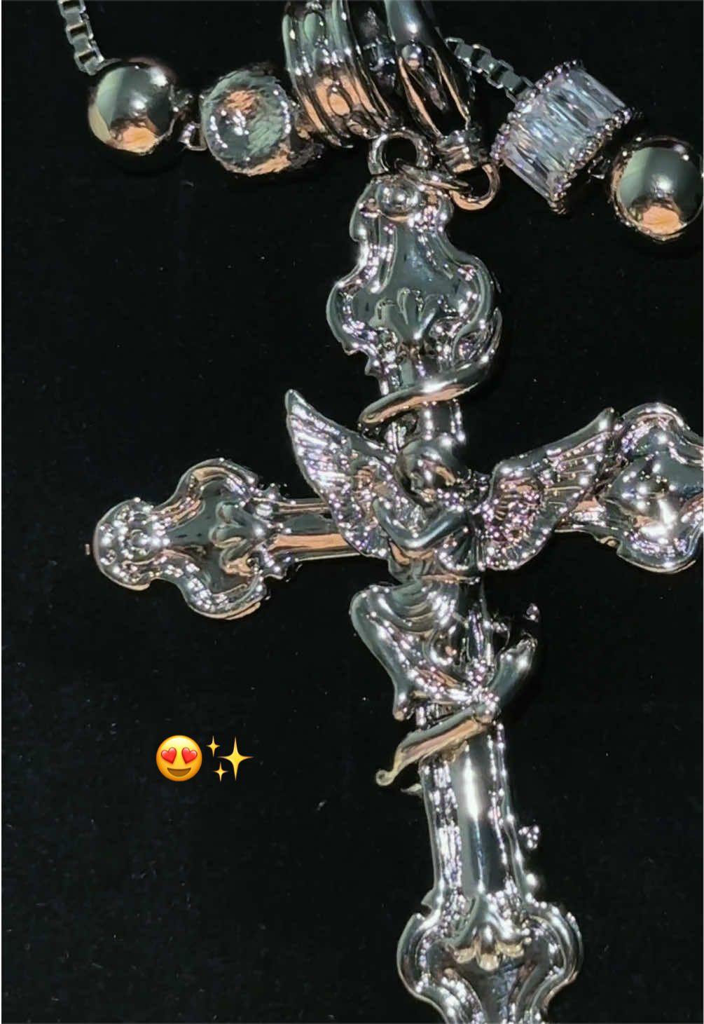 TikTok post by @xbail3y0 for GANIA. Caption reads: [...] Angel Cross necklace is so prettyyy😍😍✨....