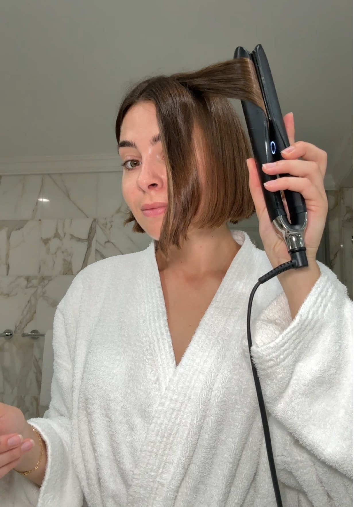 TikTok post by @emilyalgar1 for Aveda. Caption reads: Short hair routine – @Aveda Botanical Repair™....