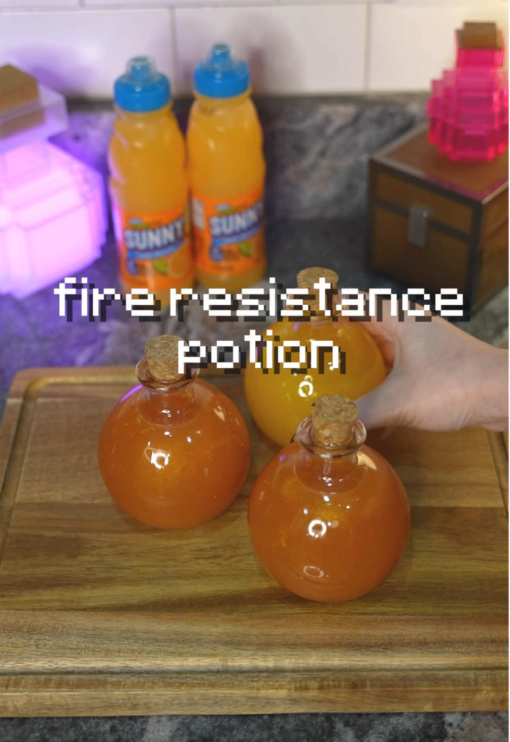 TikTok post by @hannahxxrose for SUNNYD. Caption reads: Potion Brewing IRL ft. @SUNNYD 🧡 #ad #minecraft....