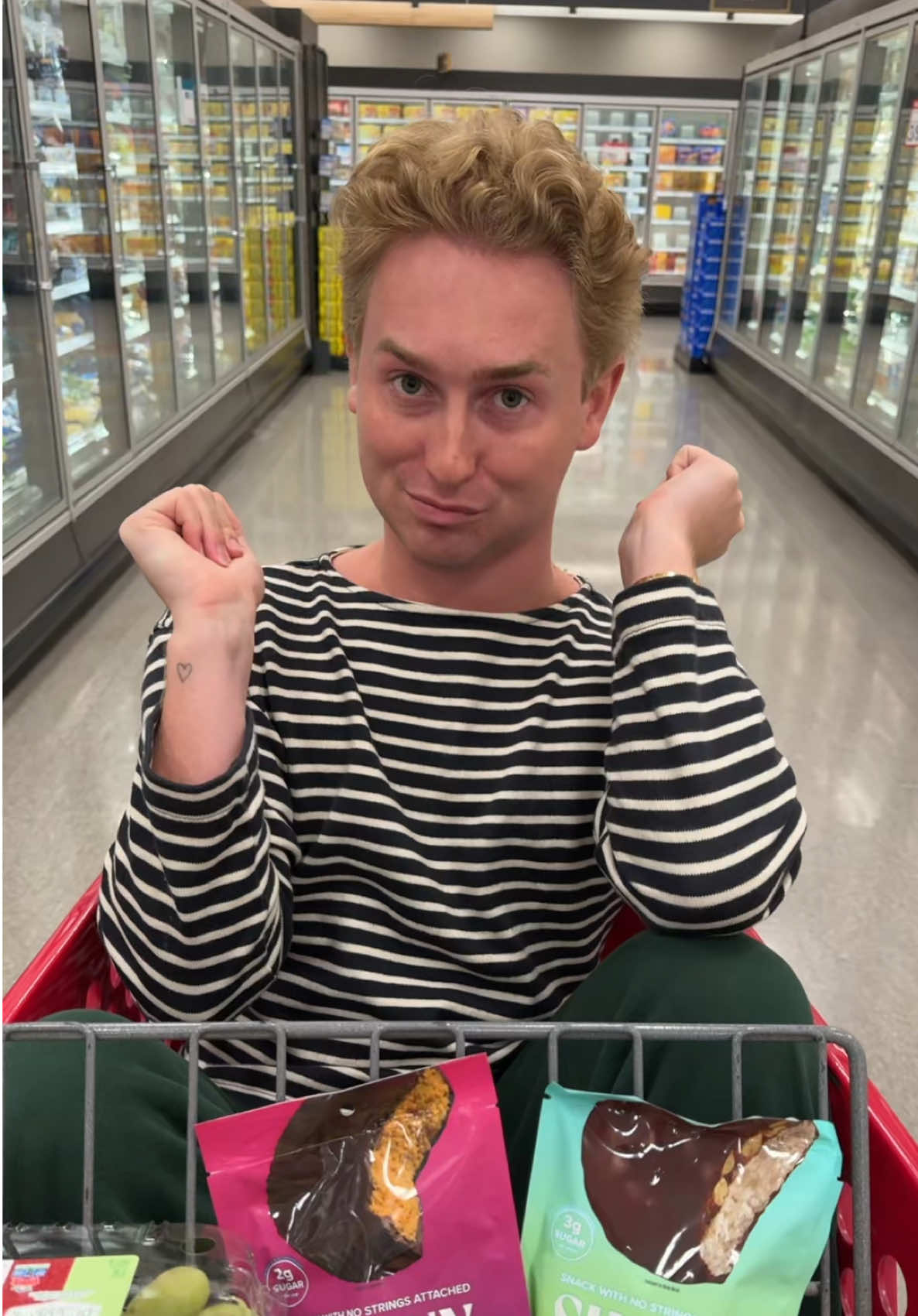 TikTok post by @findlaymcconnell for SkinnyDipped. Caption reads: consider this my 2026 go to snack 😋 @SkinnyDipped....