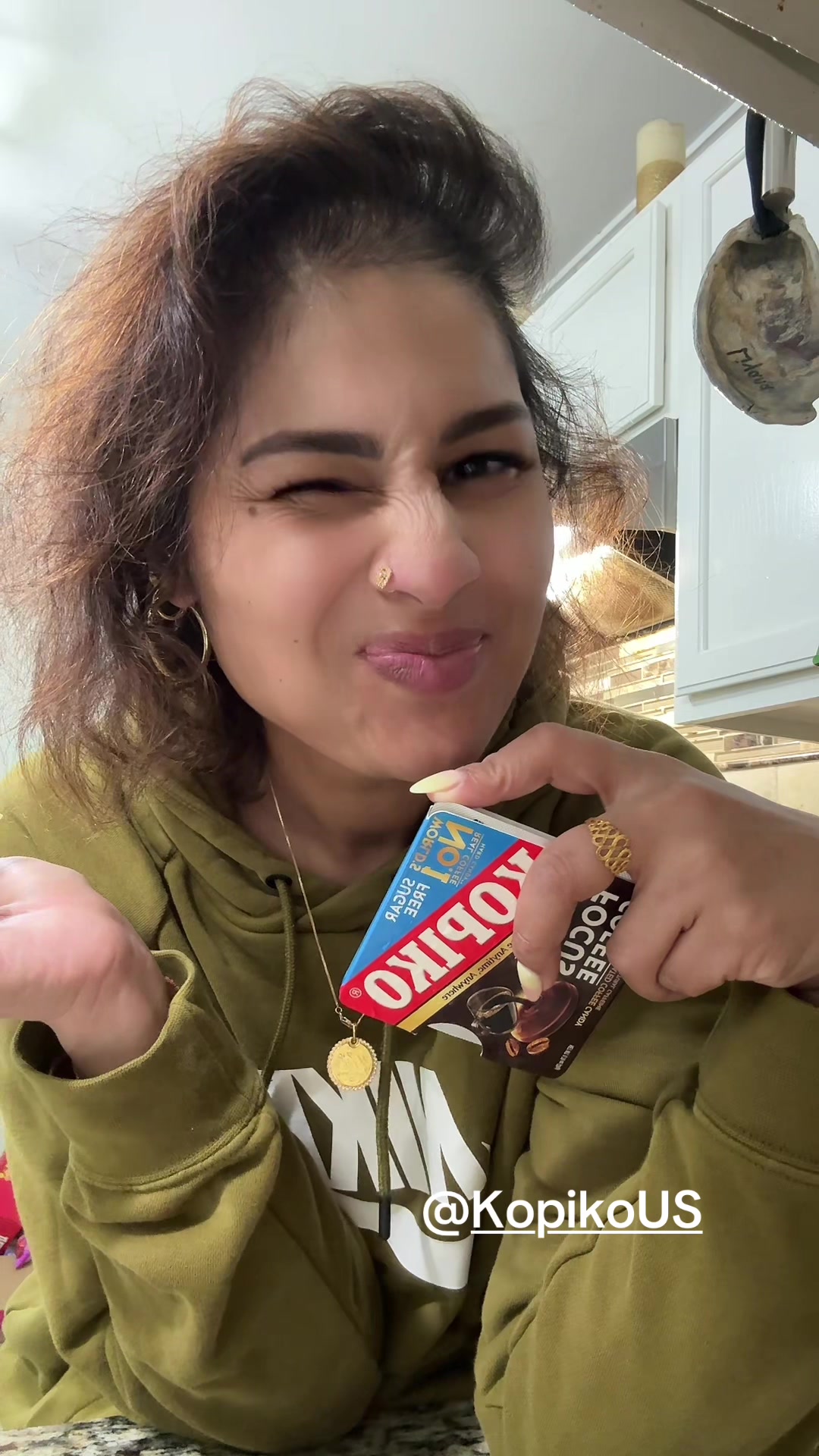 TikTok post by @makeuplaveena for Kopiko USA. Caption reads: @Kopiko US Focus Coffee #kopiko #kopikous....