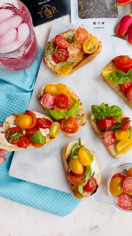 Instagram post by @aperfectfeast for Tea Runners. Caption reads: Summer on toast 🍅✨ Juicy tomatoes, fresh basil,....