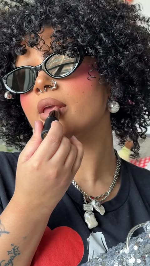 Instagram post by @anya.tisdale for Depop. Caption reads: [...] matte lipstick + my outfit curation on....