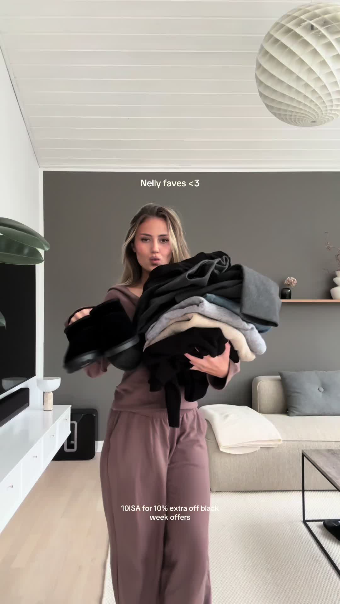 TikTok post by @isachristiansennn for Nelly. Caption reads: Reklame @NELLY.COM 💕10ISA for 10% extra off on....