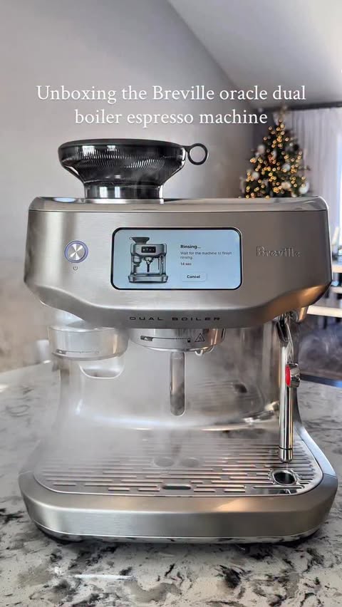 Instagram post by @coffeebyhailey for Breville. Caption reads: Unboxing the Breville Oracle Dual Boiler espresso....