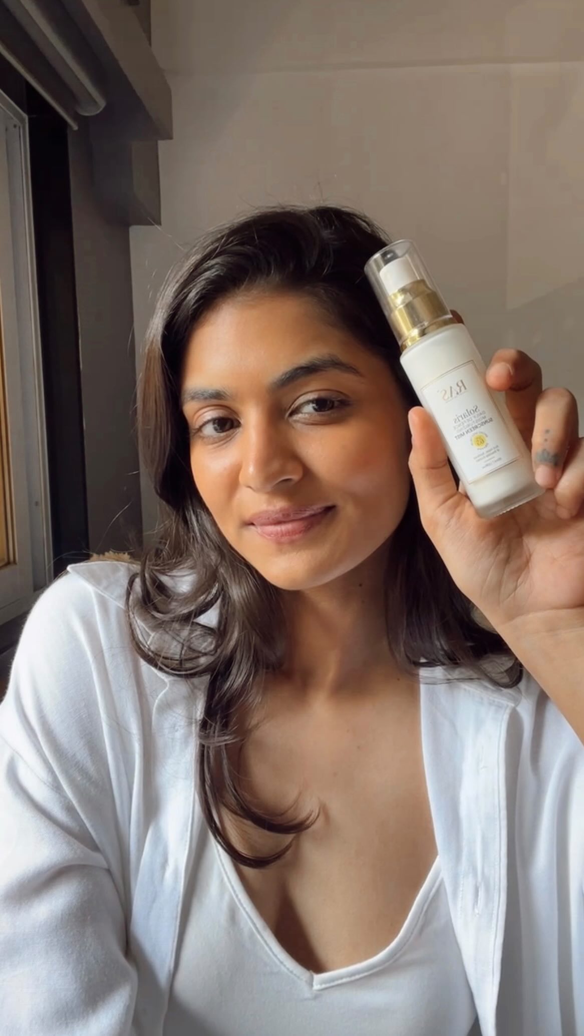 Instagram post by @aaliyawashere for RAS Luxury Oils. Caption reads: no amount of sunscreen is too much… right?....