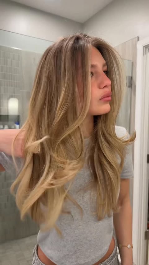 Instagram post by @ava_minaa for OUAI. Caption reads: sign me uppp @theouai #ouaipartner #hair • •....