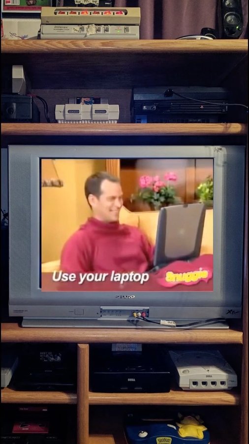 Instagram post by @thenostalgiclatino for Snuggie. Caption reads: Who needs blankets?! 😉 #snuggie #nostalgia #2000s....