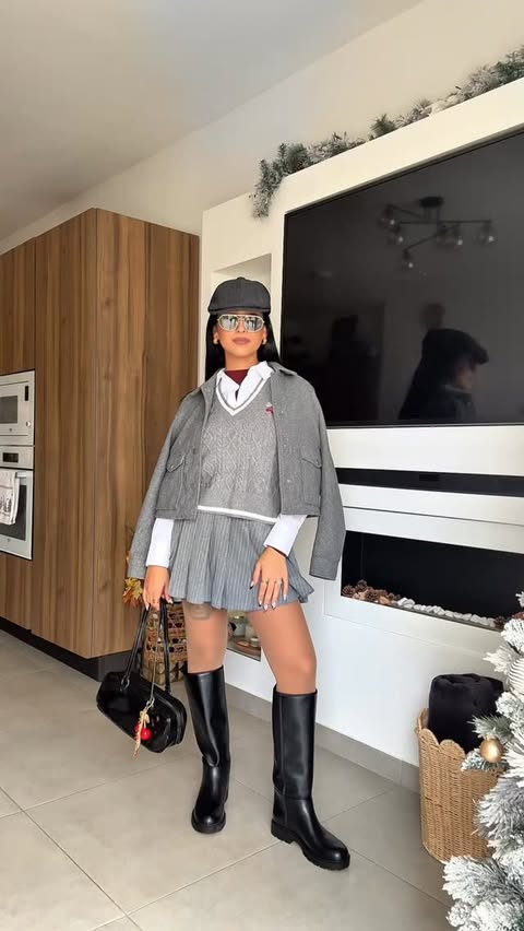 Instagram post by @abigail.vick for SPRINGFIELD. Caption reads: [...] #winterfit #greyoutfit Outfit is from....