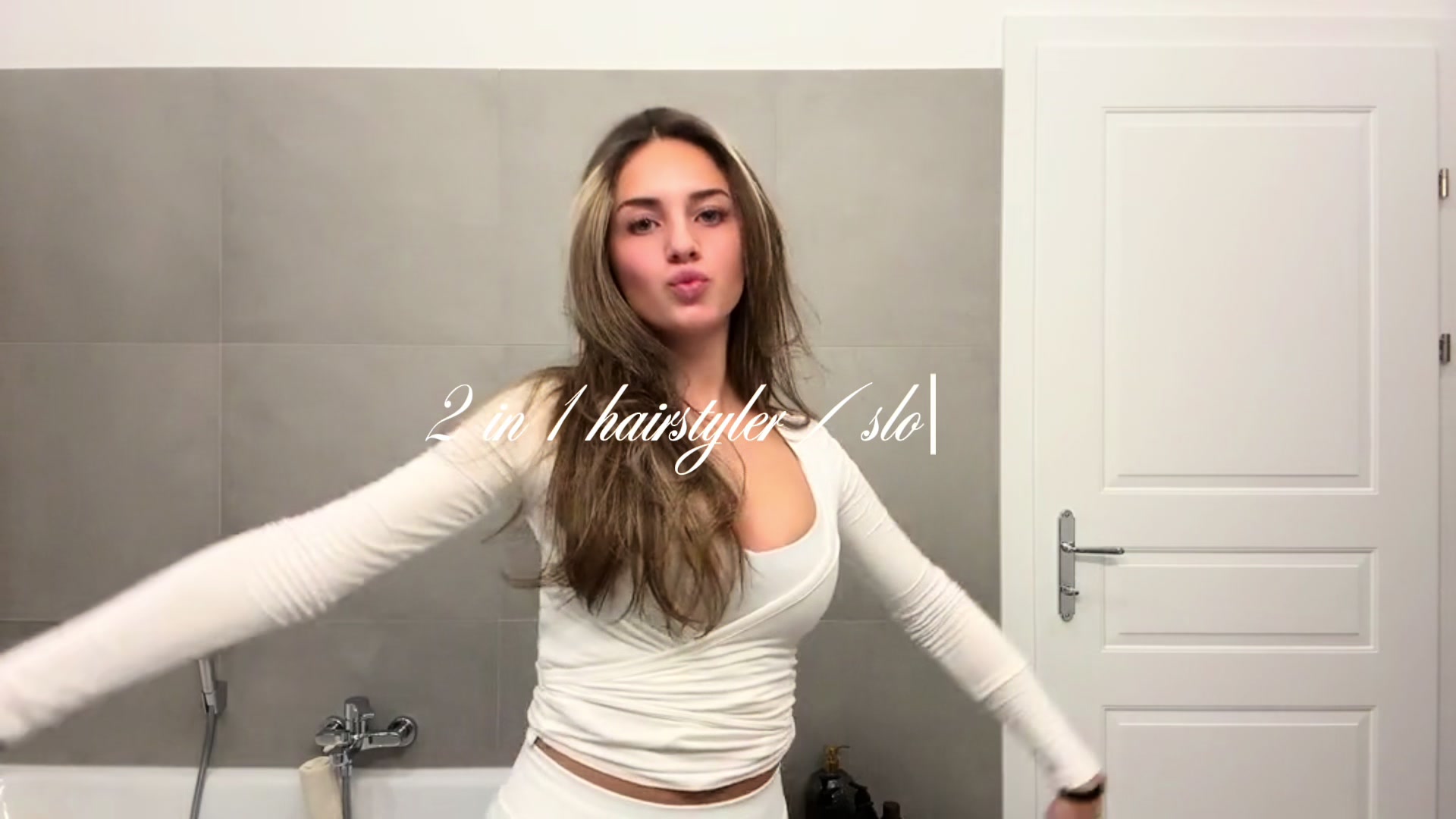 TikTok post by @emiliaselmaa for Slopehill. Caption reads: 2 in 1 hairstyler #Slopehill @Slopehill.