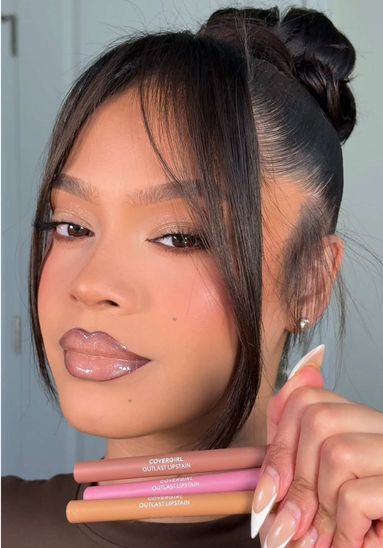 TikTok post by @logannicolemua for COVERGIRL. Caption reads: Get longer-lasting lip combos using @COVERGIRL....
