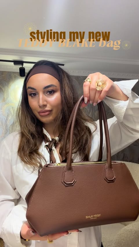 Instagram post by @rittakortava for Teddy Blake. Caption reads: [...] to wear this bag✨ #ad @teddy_blake....
