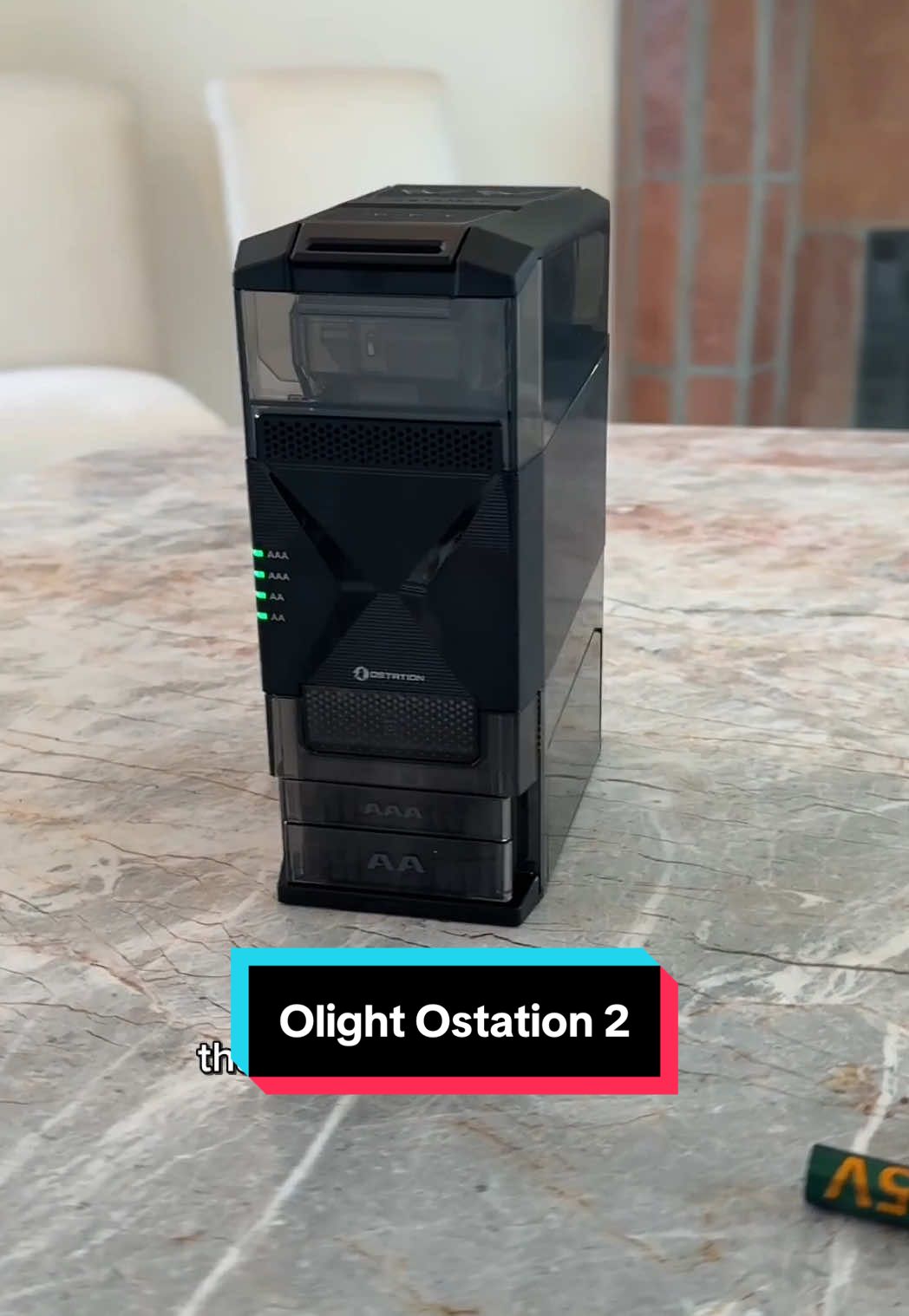 TikTok post by @trutech for Olight. Caption reads: [...] AA and AAA rechargeable batteries fast....