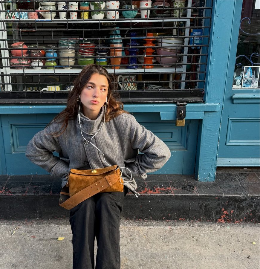 Instagram post by @rinalipa for AMI Paris. Caption reads: sunday essentials, the carrousel @amiparis 🤎

#ad.