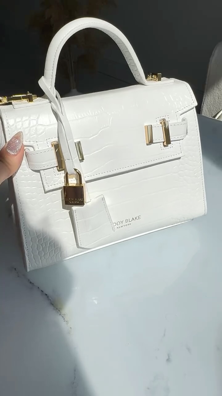 Instagram post by @tamta____________ for Teddy Blake. Caption reads: Unboxing my favorite luxury bag
@teddy_blake....