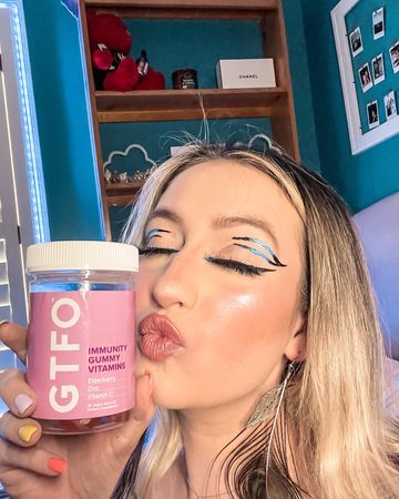 Instagram post by @literallylizzi for O Positiv. Caption reads: Needing an immune boost? Say GTFO to anything....