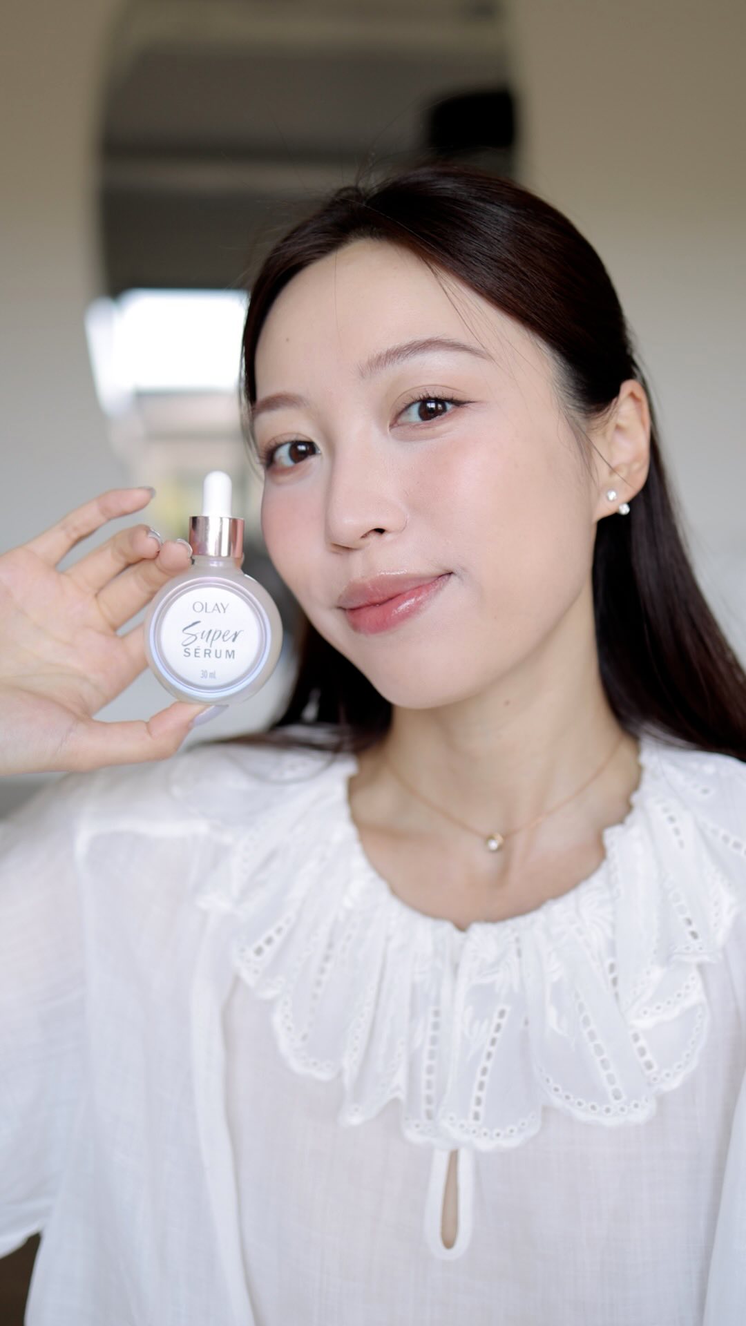 Instagram post by @oops_ohemma for OLAY. Caption reads: 皮肤好状态的秘密武器 @olay Super Serum
#ad.