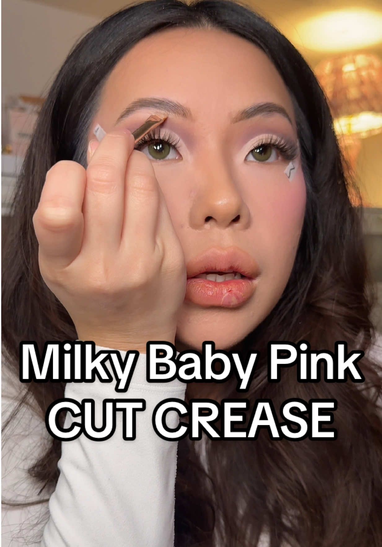 TikTok post by @christxiee for MADE BY MITCHELL. Caption reads: Replying to @okkk THE milky baby pink cut crease &....