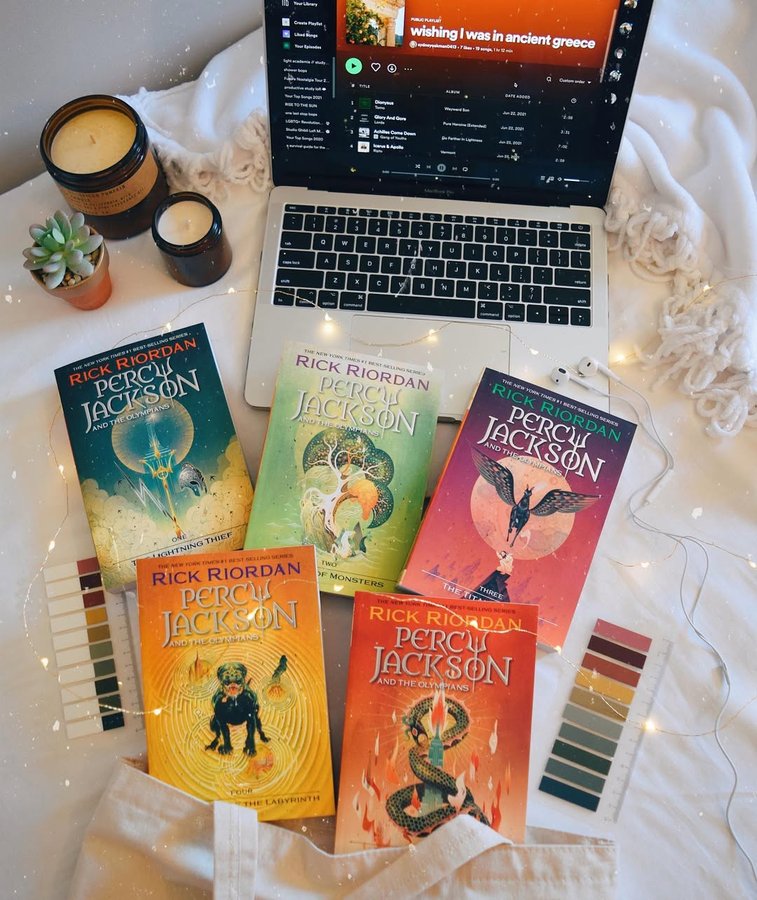 Instagram post by @booknerd_reads for Read Riordan. Caption reads: ad | Who else is a big Percy Jackson fan? 🔱🌊⚡️I....