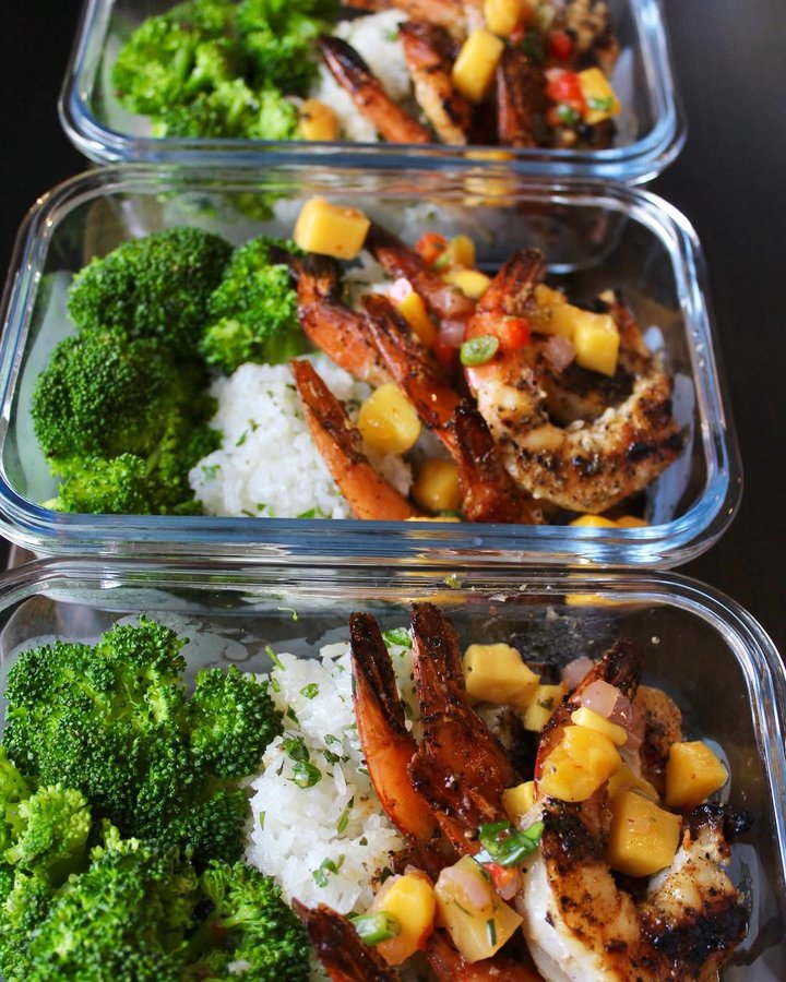 Instagram post by @a.gonzalezfit for Megafit Meals. Caption reads: 🍛🔥🍴MealPrep #Friday Gains🔪🔥🍲 🍍Pineapple +....