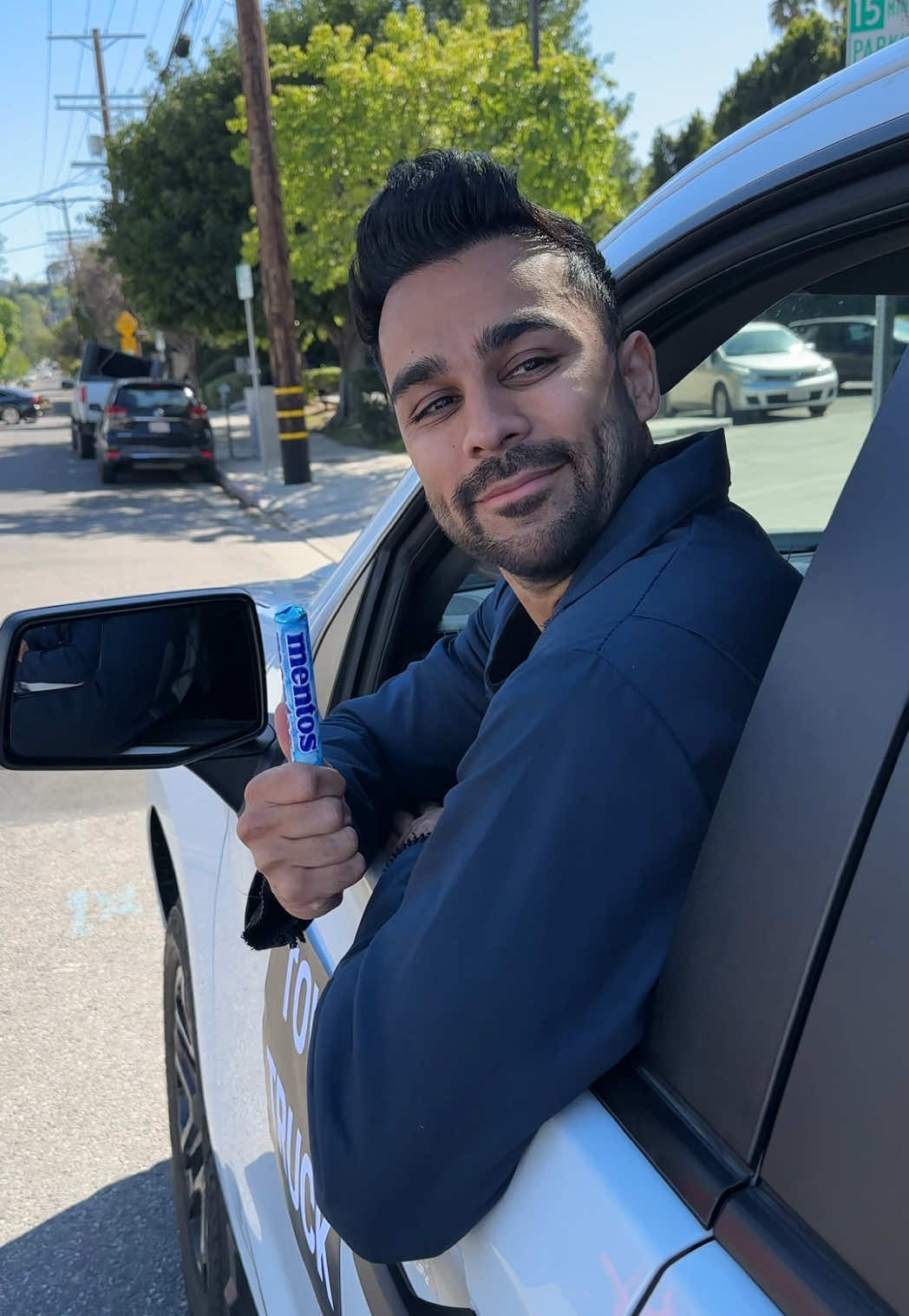 TikTok post by @adamw for Mentos. Caption reads: #ad When ur car gets towed... flip the script with....