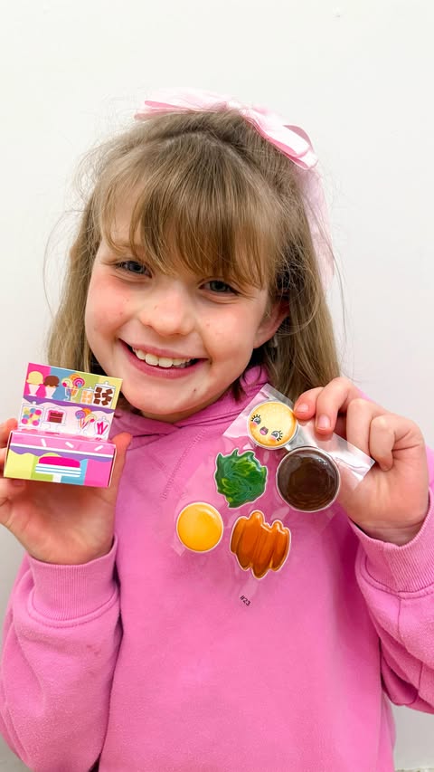 Instagram post by @girlstribe3 for The Entertainer. Caption reads: Puffy Puffs Stickers - @johnadams_toys - AD

Get....