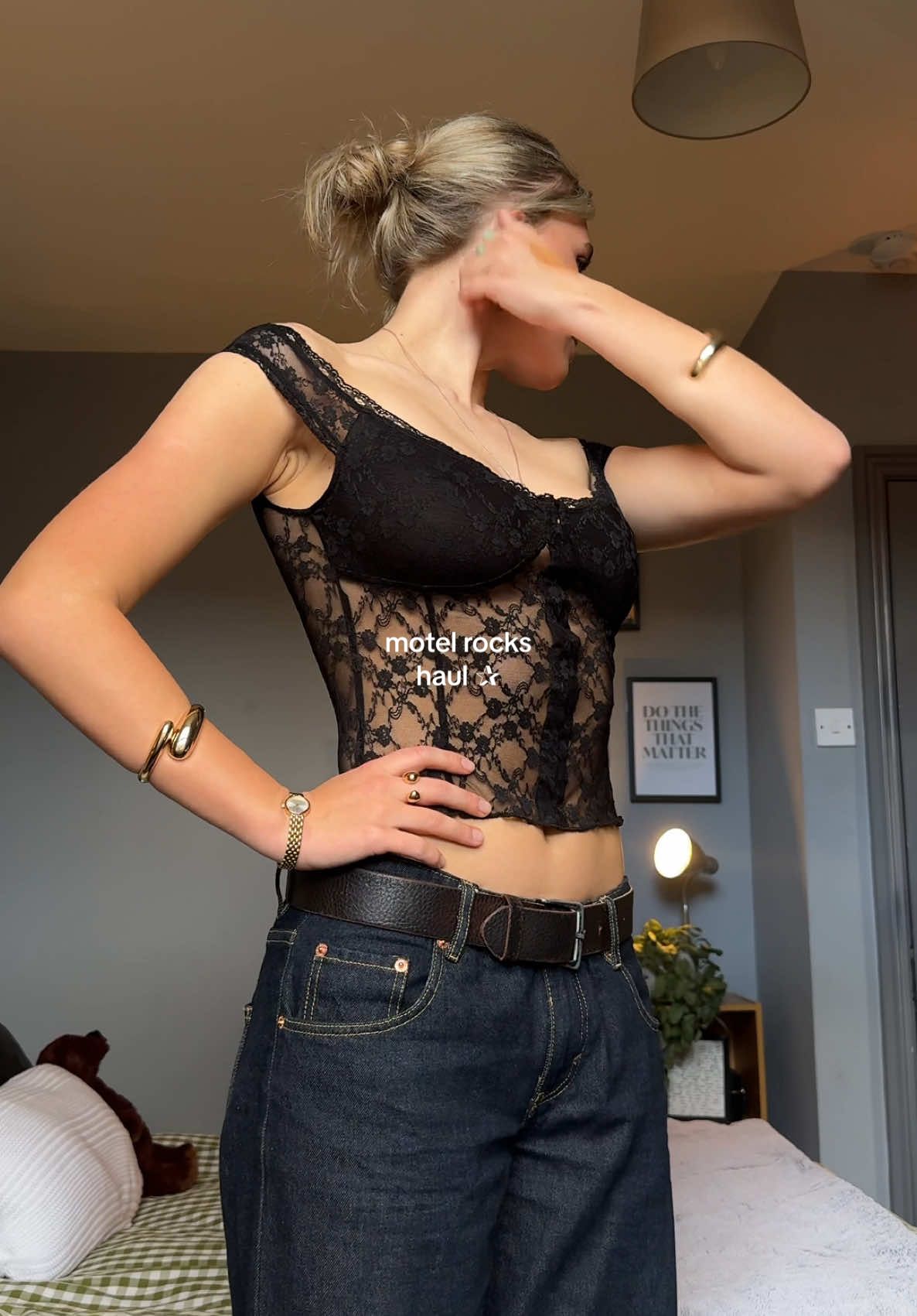 TikTok post by @emilylilburn for MOTEL. Caption reads: why do I kinda love the blue sparkly top #haul....