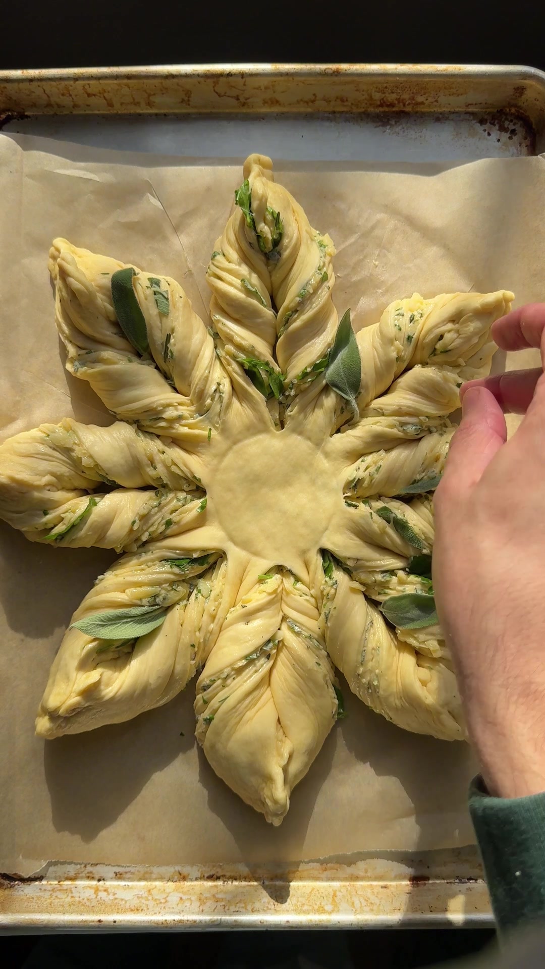TikTok post by @easygayoven for KerrygoldUSA. Caption reads: [...] Herby, Cheesy Pull-Apart Wreath with....