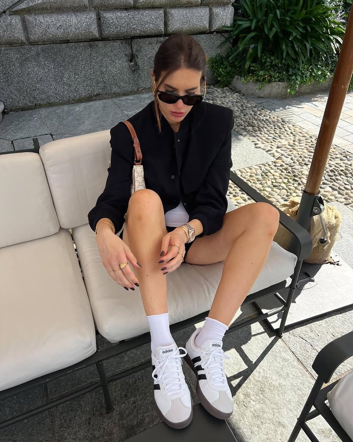 Instagram post by @gigischmitz_ for Dosenbach. Caption reads: Coolest finding of the month - Adidas sneakers....