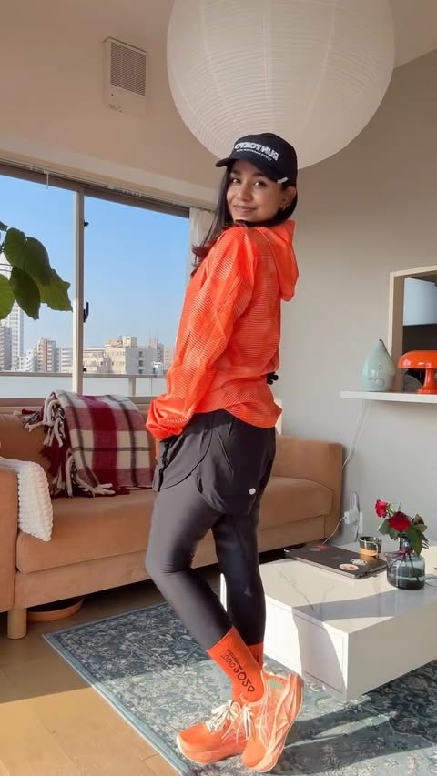 Instagram post by @hiananyaa_ for ASICS. Caption reads: 10 days till Tokyo Marathon🤍🧡 Thank you....